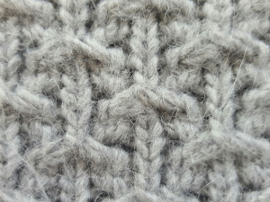 A hand knit consult to machine knit slip stitch –